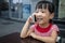 Asian Chinese little girl playing smartphone