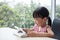 Asian Chinese little girl playing tablet computer