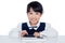 Asian Chinese little girl in uniform playing with tablet compute