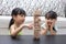 Asian Chinese little sisters playing wooden stacks