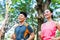 Asian Chinese man and woman jogging in city park