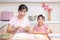 Asian Chinese mother and daughter making dumpling in the kitchen