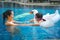 Asian chinese mother spending time with daughter at the swimming pool