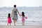 Asian Chinese mum and daughters playing sand together