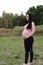 Asian Chinese pregnant woman in yoga dress in nature forest meditation do exercise workout keep healthy balanced diet and life