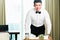 Asian Chinese room waiter serving guests food in hotel