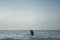 Asian chinese woman spending time playing with daughter at the beach