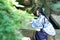 Asian Chinese woman in traditional Blue and white Hanfu dress, play in a famous garden