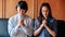 Asian Christian woman and man holding hands in praying for Jesus` blessings to show love and confession of their sins according t