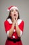 Asian Christmas girl with Santa Claus clothes shock and look up