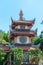 Asian church in Long Son Pagoda in Nha Trang with tropical palms