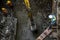 Asian construction workers laborers and excavator backhoe working for footing foundation on site of new route sky train