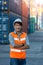 Asian Container Warehouse Worker. Foreman control loading Containers box from Cargo freight ship for import export.