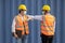 Asian Container Workers Wearing Face Mask with Elbow Greeting to Protect Themselves From Covid19 Virus