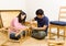 Asian couple assembling chair