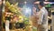 Asian couple buying flowers