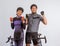 asian couple in cycling outfit standing with clenched arms