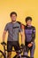asian couple in cycling outfit standing with smile