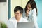 Asian couple looking at issues notification from bank about late payment home loan credit