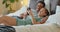 Asian couple, phone and social media for communication and entertainment on bed to relax, laughing and watch funny videp