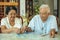 Asian couple senior playing with a jigsaw puzzle