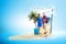 Asian couple with suitcase bag and backpack standing on the beach