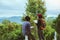 Asian couple travel relax in the holiday. Study read a book. Read a book In the garden on the Moutain. In Thailand