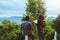 Asian couple travel relax in the holiday. Study read a book. Read a book In the garden on the Moutain. In Thailand