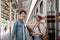 Asian couple travelers, backpack travelers, together at train station platform. tourism activity or railroad trip