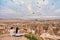 Asian couple watching colorful hot air balloons flying over the valley at Cappadocia, Turkey This Romantic time of love