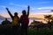 Asian couples Tourists with backpacks Standing watching landscape view on the mountain,Beautiful landscape And the light of the