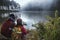 Asian couples are watching the swan, gracefully in a reservoir Pang Ung, Mae Hong Son, Thailand