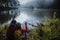 Asian couples are watching the swan, gracefully in a reservoir Pang Ung, Mae Hong Son, Thailand