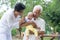 Asian crying baby comforted by grandparents