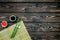 Asian cuisine set with bamboo sticks, soy sauce and ginger for sushi and maki on wooden background top view mock up