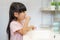 Asian cute child girl or kid brushing her teeth by toothbrush in the bathroom. Dental hygiene Healthcare concept