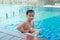 Asian cute child swimming in swimming pool. He playing is funny