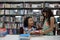 Asian cute couple young school girl giving giftbox in library