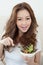 Asian cute girl eating Salad