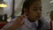 Asian cute schoolgirl drinking cold soft drink with straw in the cafeteria.