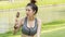 Asian cute sport healthy fit and firm slim teen girl eat ice cream in summer day at outdoor garden park