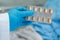 Asian doctor holding antibiotics capsule pills in blister packaging f