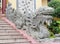 Asian dragon sculpture guard at the temple entrance