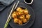 Asian dumplings in bowl, chopsticks, plates. Asian table setting. Chinese dumplings for dinner. Selective focus. Asian
