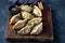Asian dumplings Gyoza potstickers on old wooden board. Top view, copy space