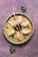 Asian dumplings with soy sauce, chopsticks on rustic purple background. Chinese dumplings for dinner. Closeup,Flat lay.