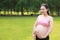 Asian Eastern Chinese happy pregnant woman in yoga dress expecting baby to born book on hand antenatal training