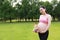 Asian Eastern Chinese happy pregnant woman in yoga dress hands hold her belly expecting baby to born plush toy bear beside excited