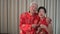 Asian elder couple holding lot of red envelop for Chinese New Year