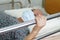 Asian elder senior woman patient holding bed rail while lie down with hope waiting her family in hospital